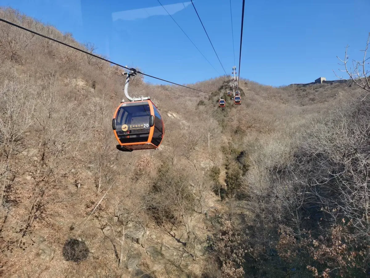Upon arrival, follow your tour guide to ascend the Great Wall via your preferred option: take the cable car for a steady, scenic ride, or choose the ski lift & toboggan combo for a fun, efficient trip. Either way saves you time, letting you focus on tour.