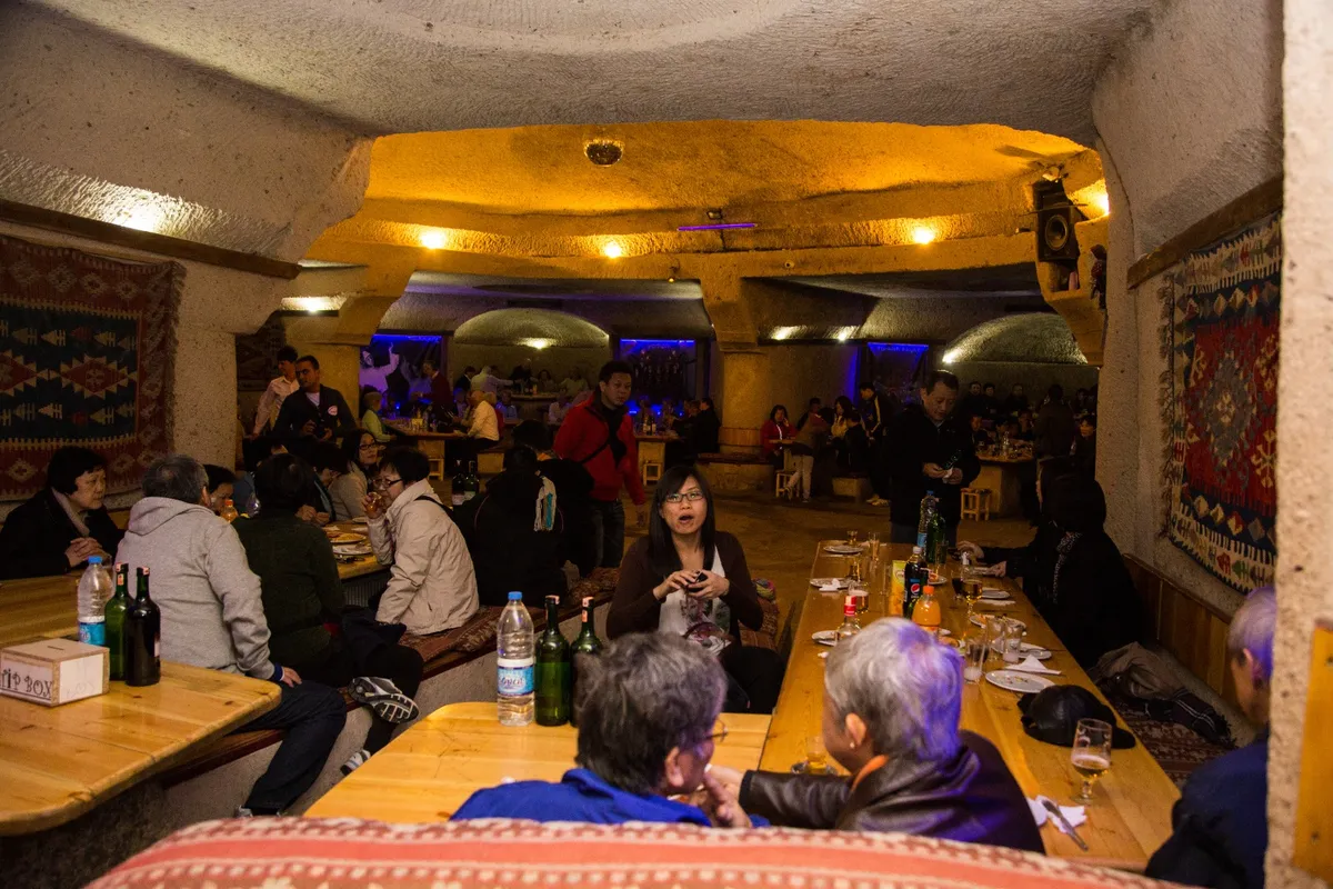 Enjoy the ambiance of a charming cave restaurant in Cappadocia as you feast on your meal and drink