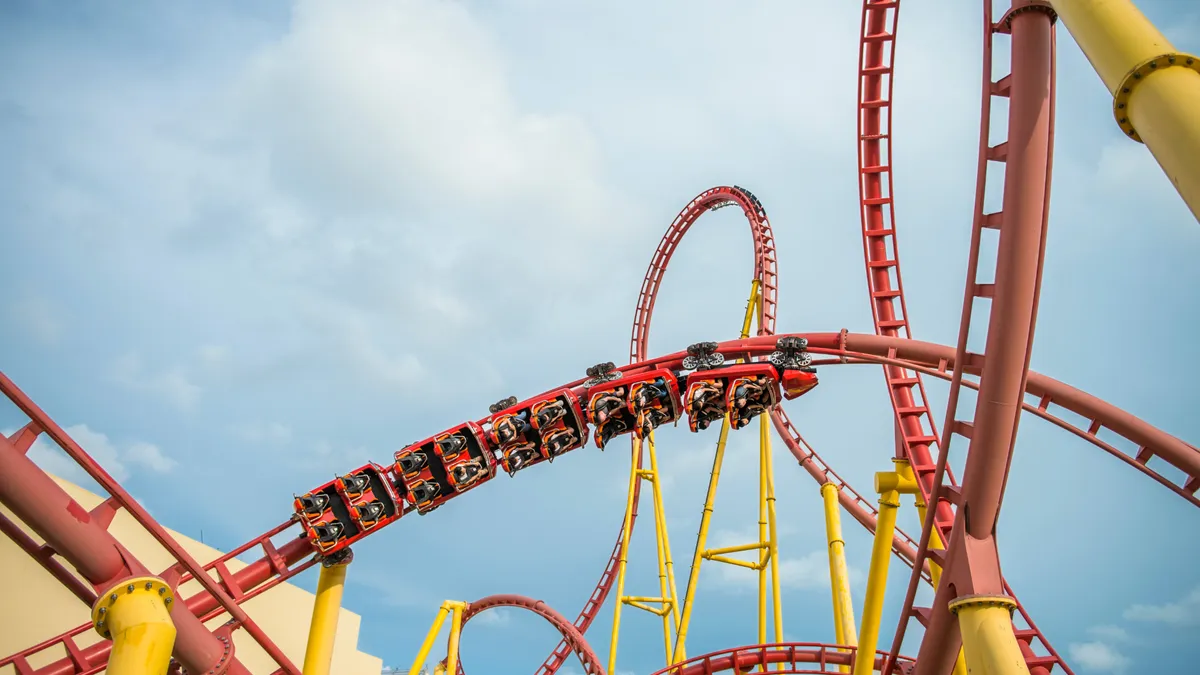 Brace yourself for a thrilling ride and conquer the powerful waves when surfing the incredible Zeus Firestorm roller coaster.