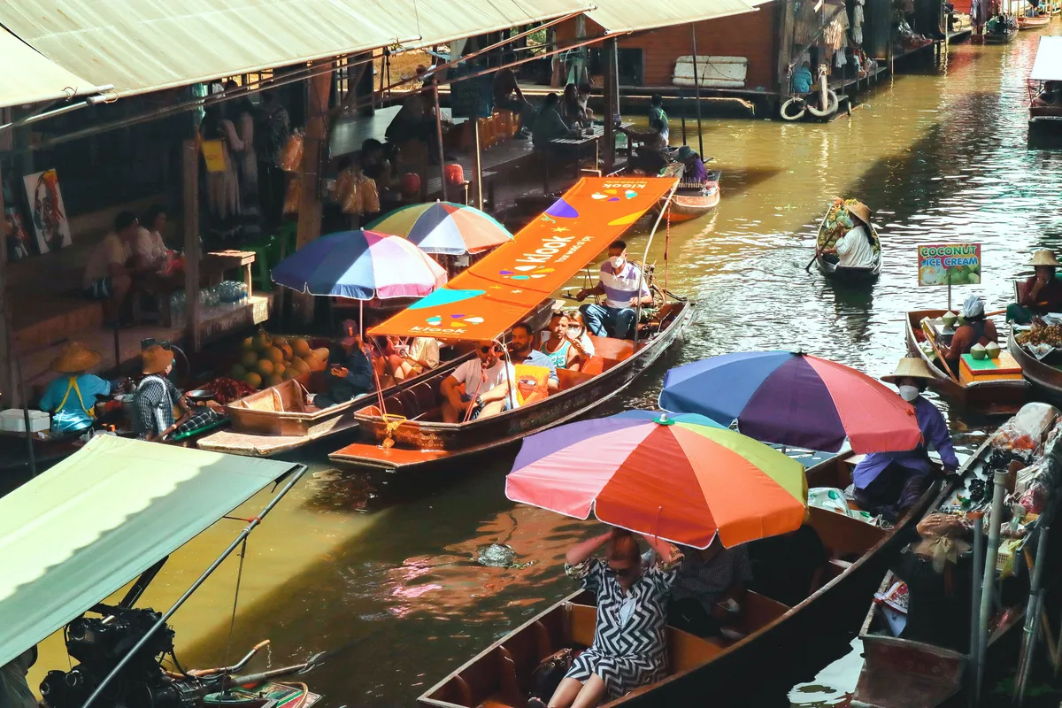 Navigating Thailand's Iconic Markets: A Comprehensive Review of the Damnoen Saduak & Maeklong Tour