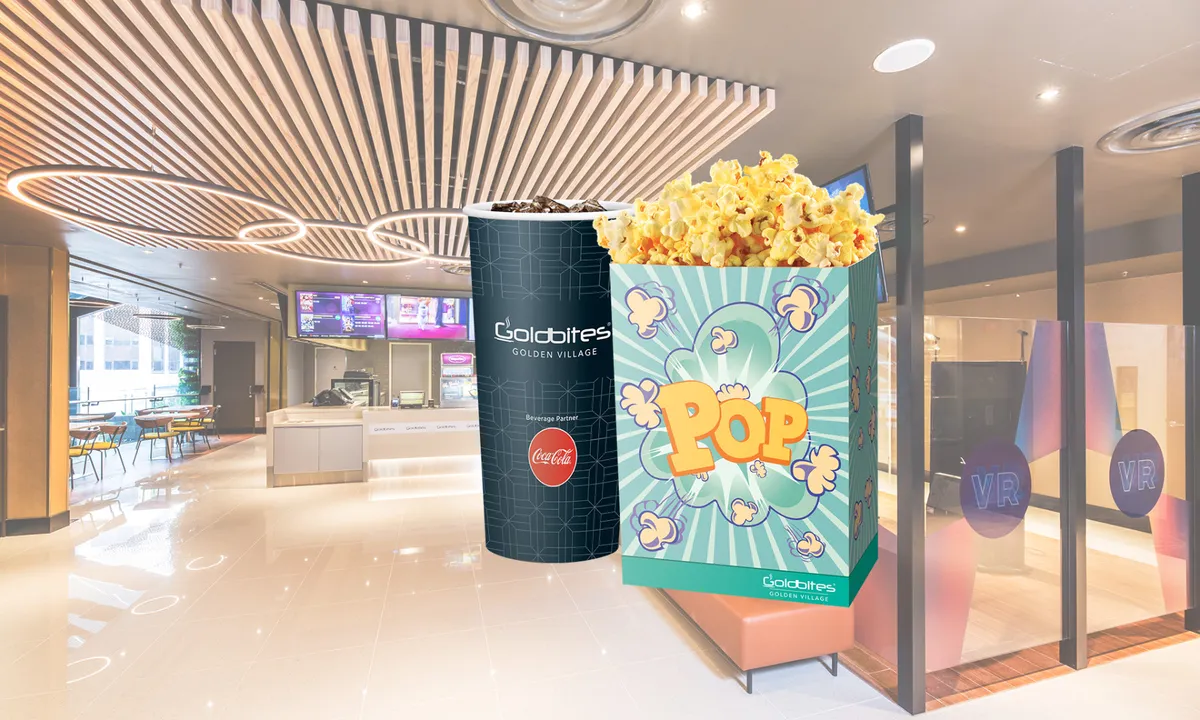 Enjoy the ultimate movie snack: Popcorn and a large drink set, perfect for cinema indulgence