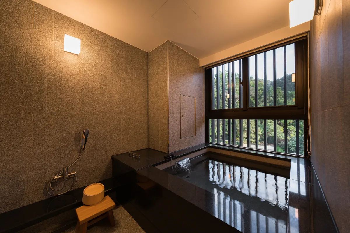 Japanese-Style Suite: The calming decor and color scheme in the guest room create a relaxing atmosphere.