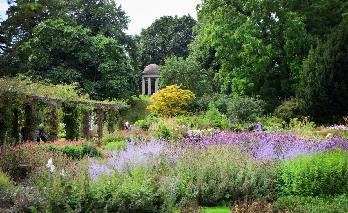 Frolick and explore through sprawling gardens, bridges, and paths in London's largest UNESCO World Heritage Site