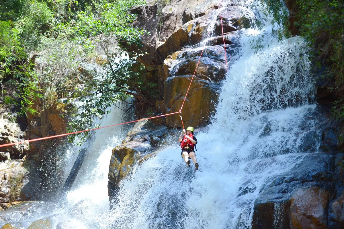 Hold on tight as you rappel down the raging falls of Datanla