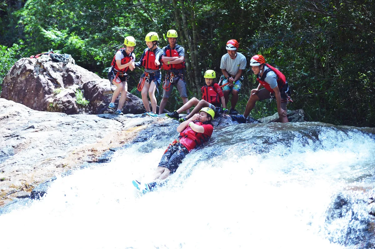 Slide down slippery rocks and into the rapids that lead to a flowing river
